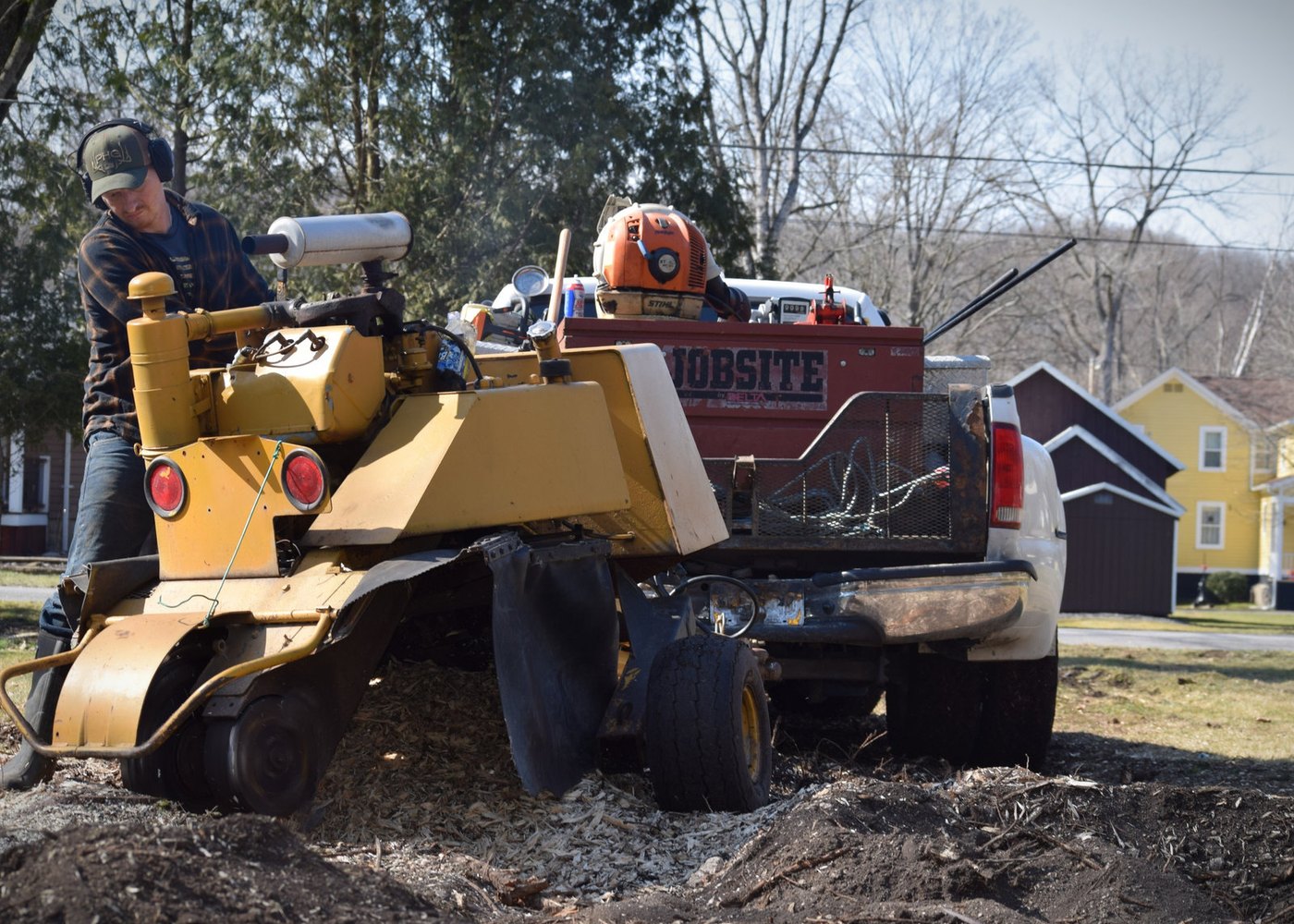 An Above and Beyond stump grinder and work truck on a job in Central New York